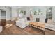 Open living area with sectional sofa and wood floors at 609 S Glen Ave # B, Tampa, FL 33609