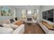 Spacious living room featuring a fireplace and sectional sofa at 609 S Glen Ave # B, Tampa, FL 33609