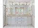 Bathroom with double vanity, granite countertop and large mirror at 705 Loma Linda Ct, Brandon, FL 33511