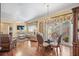 Bright dining room with hardwood floors and access to the living room at 705 Loma Linda Ct, Brandon, FL 33511