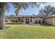 House exterior with manicured lawn and a brick walkway at 705 Loma Linda Ct, Brandon, FL 33511
