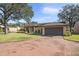 House exterior with attached garage and well-maintained landscaping at 705 Loma Linda Ct, Brandon, FL 33511
