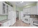 Spacious kitchen with white cabinets, granite countertops, and ample storage at 705 Loma Linda Ct, Brandon, FL 33511