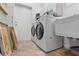 Laundry room with washer, dryer, utility sink, and additional storage at 705 Loma Linda Ct, Brandon, FL 33511