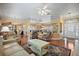 Open living space with hardwood floors and a large mirror adding depth at 705 Loma Linda Ct, Brandon, FL 33511