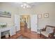 Bright home office with hardwood floors and wicker furniture at 705 Loma Linda Ct, Brandon, FL 33511