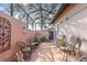 Screened patio with terracotta tile and surrounded by plants at 705 Loma Linda Ct, Brandon, FL 33511