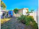 Backyard with side yard and partial view of home at 7521 Coventry Dr, Port Richey, FL 34668