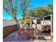 Patio with brick fireplace and seating area, perfect for outdoor dining at 7521 Coventry Dr, Port Richey, FL 34668