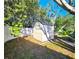 Backyard shed nestled amongst trees at 7521 Coventry Dr, Port Richey, FL 34668