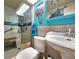 Updated bathroom with walk-in shower and beach theme at 7521 Coventry Dr, Port Richey, FL 34668