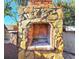 Outdoor brick fireplace with stone facade at 7521 Coventry Dr, Port Richey, FL 34668