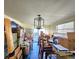 Dining room with table and chairs, currently packed with boxes at 7521 Coventry Dr, Port Richey, FL 34668