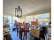 Dining room with table and chairs, currently packed with boxes at 7521 Coventry Dr, Port Richey, FL 34668