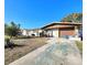 Ranch-style home with a single car garage and a well-manicured lawn at 7521 Coventry Dr, Port Richey, FL 34668