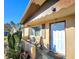 Covered porch with seating area and mature cactus plants at 7521 Coventry Dr, Port Richey, FL 34668
