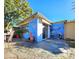 Charming patio with fire pit and unique mural at 7521 Coventry Dr, Port Richey, FL 34668
