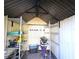 Organized storage shed with shelving for bikes and gardening tools at 7521 Coventry Dr, Port Richey, FL 34668
