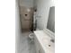 Updated bathroom with walk-in shower and vanity at 8601 Twin Lakes Blvd, Tampa, FL 33614