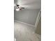Bright bedroom with ceiling fan and marble-look tile floor at 8601 Twin Lakes Blvd, Tampa, FL 33614