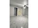 Spacious bedroom with double closets and marble-look floors at 8601 Twin Lakes Blvd, Tampa, FL 33614