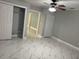 Spacious bedroom with double closets and marble-look floors at 8601 Twin Lakes Blvd, Tampa, FL 33614