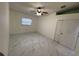 Bright bedroom with a window, closet and marble-look flooring at 8601 Twin Lakes Blvd, Tampa, FL 33614