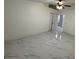 Spacious bedroom with ceiling fan and marble-look flooring at 8601 Twin Lakes Blvd, Tampa, FL 33614