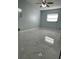 Spacious bedroom with window and ceiling fan at 8601 Twin Lakes Blvd, Tampa, FL 33614