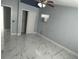 Spacious bedroom with ceiling fan and updated flooring at 8601 Twin Lakes Blvd, Tampa, FL 33614