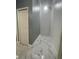 Clean hallway with white doors and marble-look floors at 8601 Twin Lakes Blvd, Tampa, FL 33614