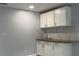 White kitchen cabinets and granite countertop at 8601 Twin Lakes Blvd, Tampa, FL 33614