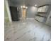 Modern kitchen with white cabinets and marble-look floors at 8601 Twin Lakes Blvd, Tampa, FL 33614