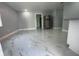 Open living area with marble-look floors and kitchen view at 8601 Twin Lakes Blvd, Tampa, FL 33614