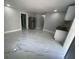 Open concept living room and kitchen with marble-look floors at 8601 Twin Lakes Blvd, Tampa, FL 33614