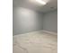 Bright spare room with marble-look floors at 8601 Twin Lakes Blvd, Tampa, FL 33614