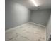 Spacious spare room with marble-look floors at 8601 Twin Lakes Blvd, Tampa, FL 33614