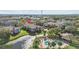 Aerial view of condo building near lake and pool at 10265 Gandy N Blvd # 905, St Petersburg, FL 33702