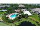 Community pool, hot tub, and volleyball court, near lake at 10265 Gandy N Blvd # 905, St Petersburg, FL 33702