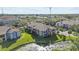 Aerial community view showcasing well-maintained lawns, ponds, and surrounding neighborhood at 10265 Gandy N Blvd # 905, St Petersburg, FL 33702