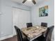 Small dining area with granite-topped table and four black chairs at 10265 Gandy N Blvd # 905, St Petersburg, FL 33702