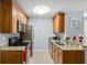 Open concept kitchen with wood cabinets and granite countertops at 10265 Gandy N Blvd # 905, St Petersburg, FL 33702