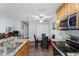Open kitchen with granite countertops and stainless steel appliances at 10265 Gandy N Blvd # 905, St Petersburg, FL 33702