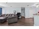 Living room features gray sectional sofa and dark wood floors at 10265 Gandy N Blvd # 905, St Petersburg, FL 33702
