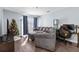 Living room features a gray sectional sofa and a Christmas tree at 10265 Gandy N Blvd # 905, St Petersburg, FL 33702