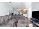 Spacious living room featuring a sectional sofa and large TV at 10265 Gandy N Blvd # 905, St Petersburg, FL 33702