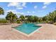 Inviting community pool with a separate spa and deck at 10265 Gandy N Blvd # 905, St Petersburg, FL 33702