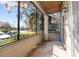 Screened-in porch overlooking a parking lot and trees at 10265 Gandy N Blvd # 905, St Petersburg, FL 33702