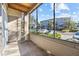 Screened-in porch with view of parking lot and other buildings at 10265 Gandy N Blvd # 905, St Petersburg, FL 33702