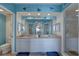 Double vanity bathroom with granite countertops and a large mirror at 1200 Country Club Dr # 2504, Largo, FL 33771